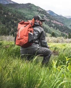 Simms Dry Creek Rolltop Backpack -Fishpond Store 13463 800 Dry Creek Rolltop Backpack lifestyle S22 1680x 81e14b87 e87b 4b1a 8a28 251ee342f5d7
